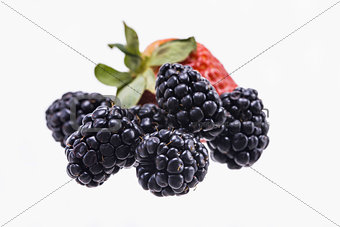 Fresh strawberries and Blackberry isolated on white background