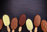 Ice cream on stick covered with chocolate 