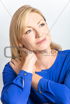 Studio Portrait of Healthy Thoughtful Middle Aged Woman 