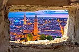 Verona historic skyline evening view through stone window