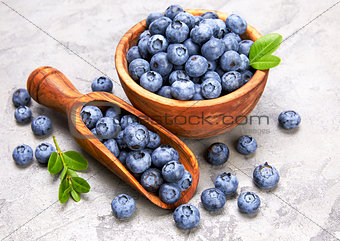 Berry blueberry in wooden dish with scoop