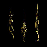 Luxury hand drawn golden feathers isolated on a black background. Vector elements for your design.