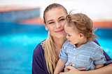 Mother with son near pool