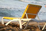 Chaise longue on the sand beach