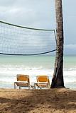 Chaise longues and Volley net on the beach