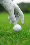 Detail of golf ball and gloves