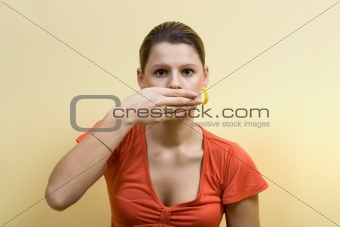 woman closes mouth hands