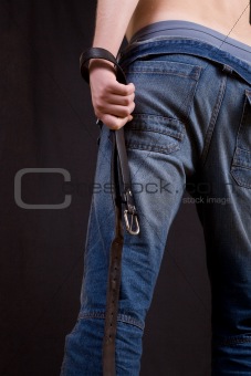 Male back in jeans with belt