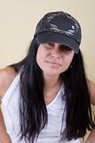 black hair young woman in cap