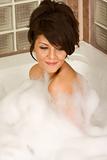 Attractive young gorges woman taking bath