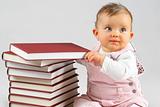 small baby and books