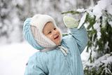 Kid with snowy branch