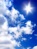sun and clouds on blue sky