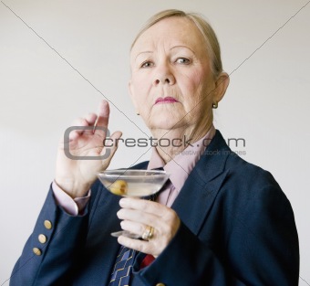 Dramatic Senior Woman with a Martini