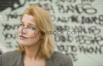 Woman in front of graffiti