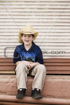 Smiling Boy Wearing a Cowboy hat