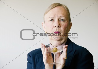 Dramatic Senior Woman with a Martini