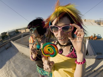 Fun girls on the roof with lollipops