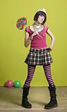 Young punk woman with a big lollipop