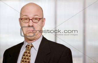 Businessman making a funny face