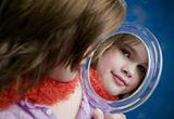 Little Girl Looking a Mirror