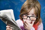 Girl with Glasses and a Newspaper