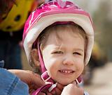 Little girl in a bicycle helmet