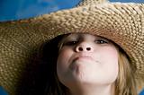 Little girl with a straw hat