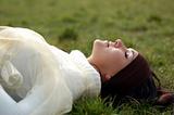 woman relaxing on grass