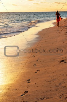 Woman walking on beach 