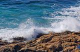 waves crashing onto rocks