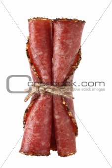 three pieces slices german pepper salami sausage tied by rope