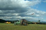 plane and helicopter on a field of green