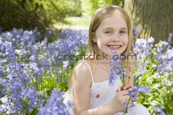 Young girl in bluebell wood