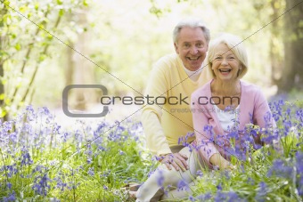 Senior couple in bluebell woods