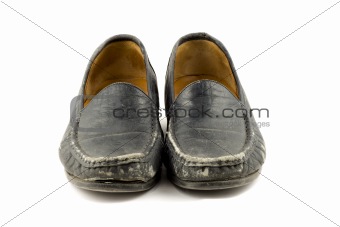 Old grungy womens shoe isolated on white background