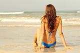woman sitting on the beach