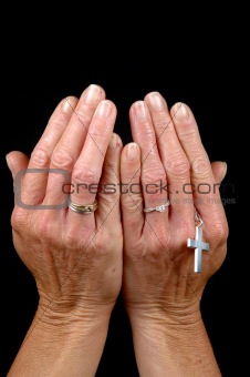 Hands, rings and cross