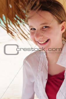 Young girl on tropical beach 