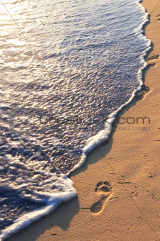 Tropical beach with footprints