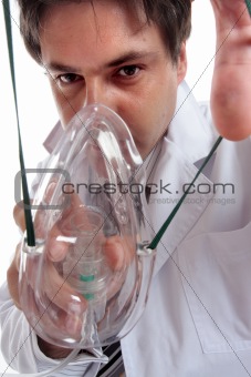 Doctor putting on oxygen mask