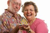 Happy Senior Couple & Home