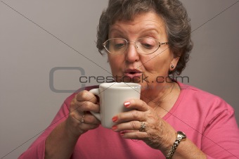 Senior Woman Enjoys Her Coffee