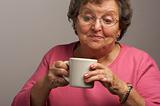 Senior Woman Enjoys Her Coffee