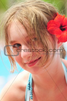 Portrait of a girl with red flower