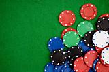 Poker chips on green background