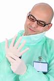 surgeon putting medical gloves on