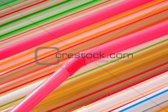 Multi-coloured straws for a cocktail