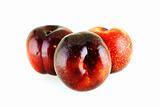 three fresh ripe sweet plums