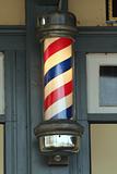 Old barber pole on a building